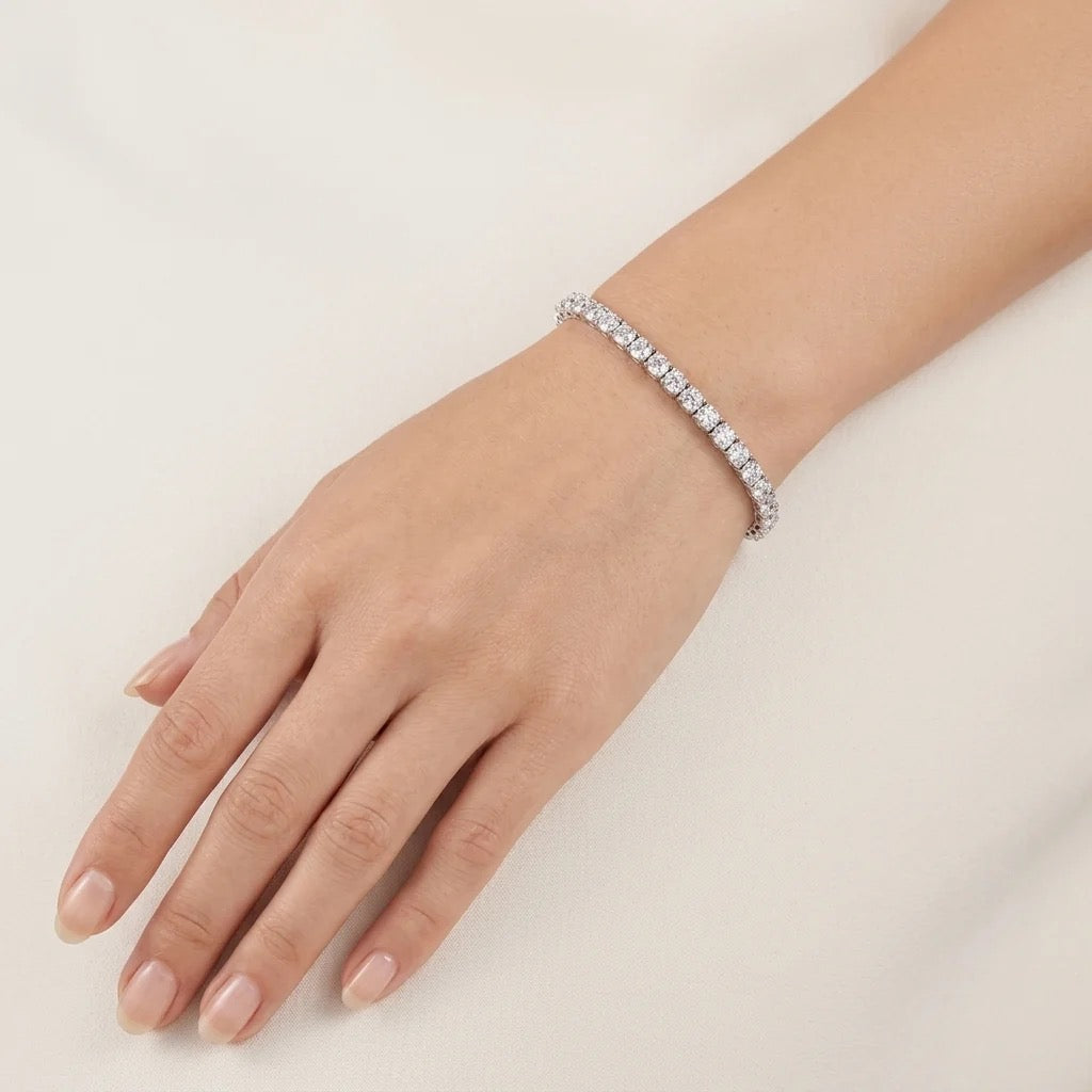 Natural round diamond tennis bracelet worn on wrist