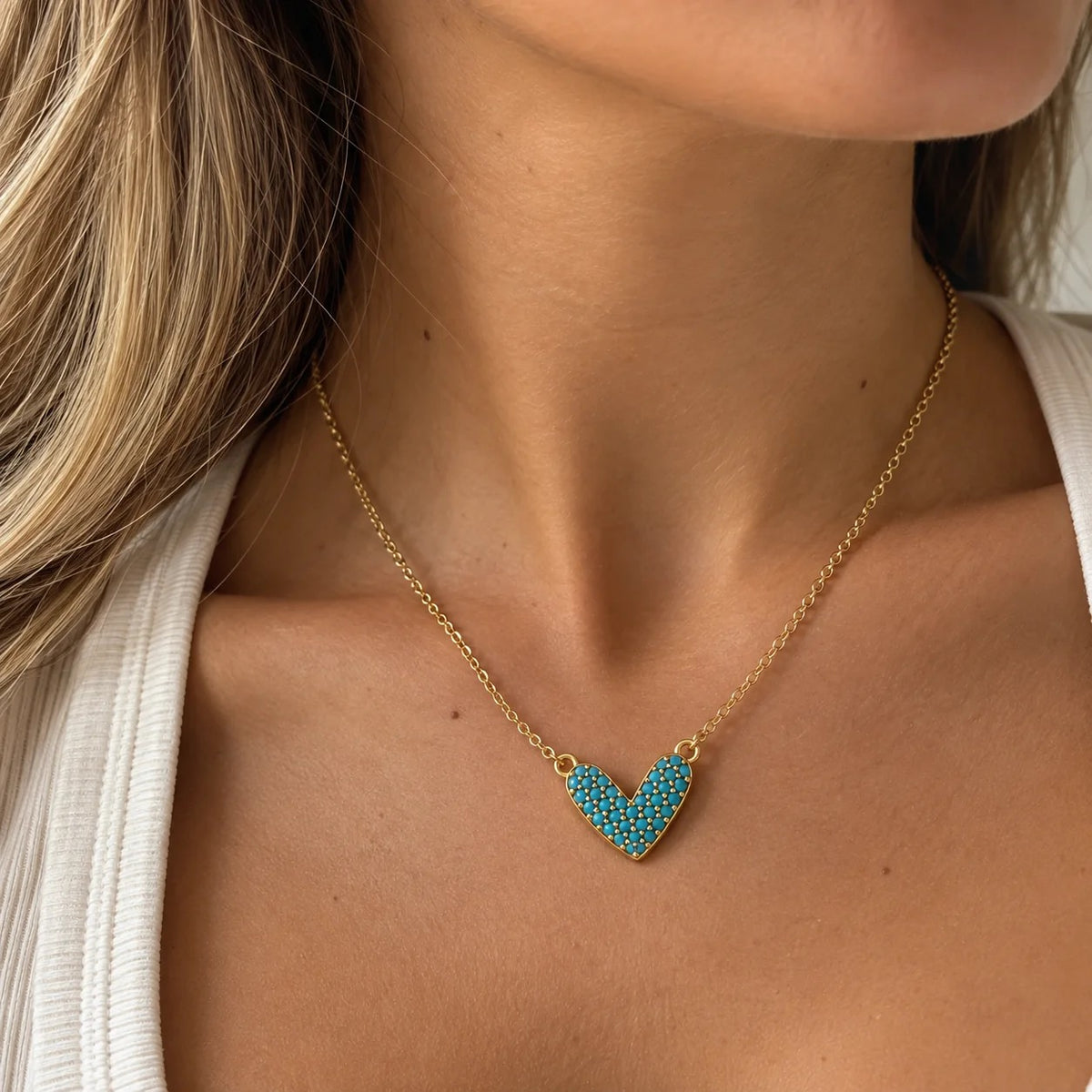 Model wearing the SR OF GOLD CORA necklace in turquoise color.
