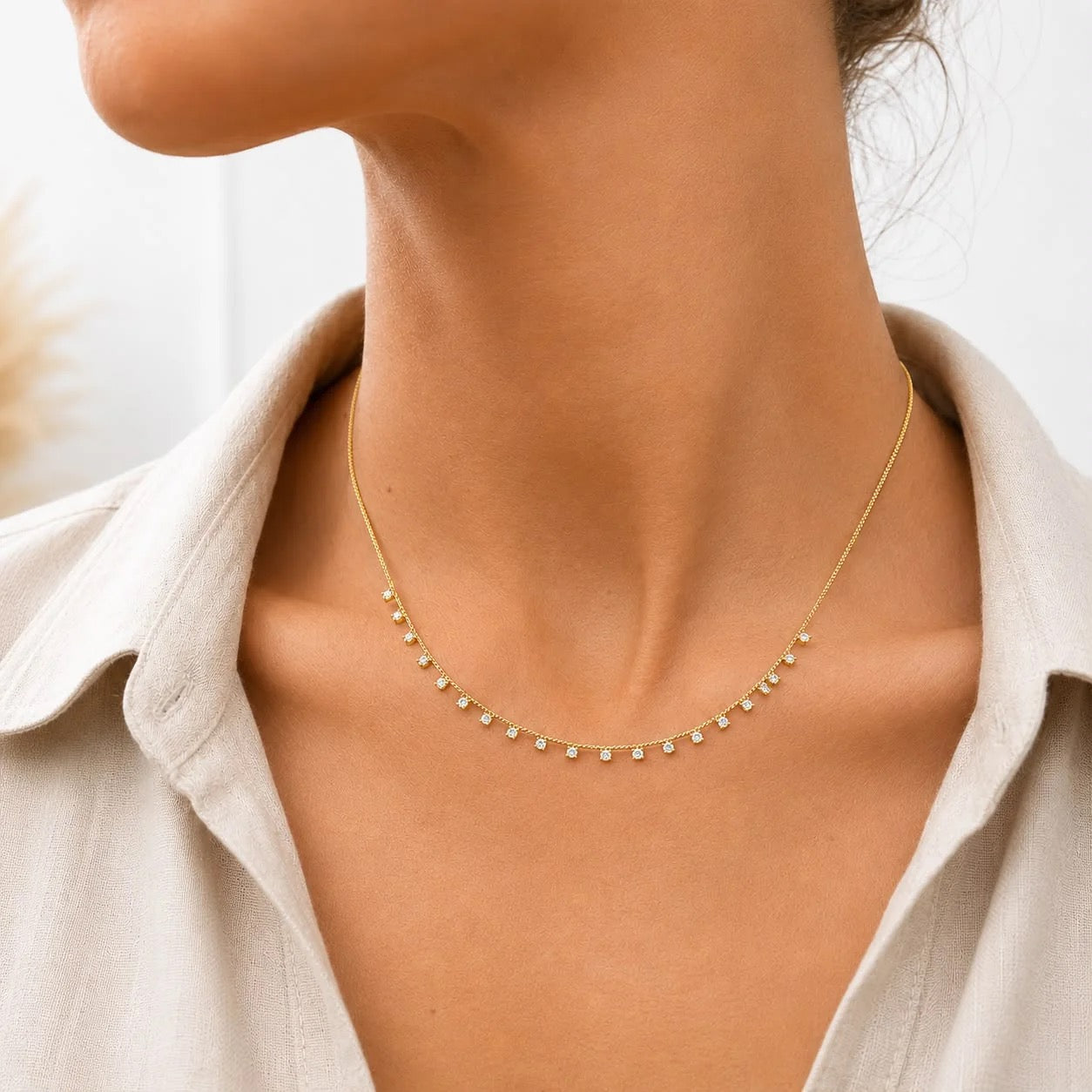 Gold-finish square cubic zirconia dainty choker worn on neck