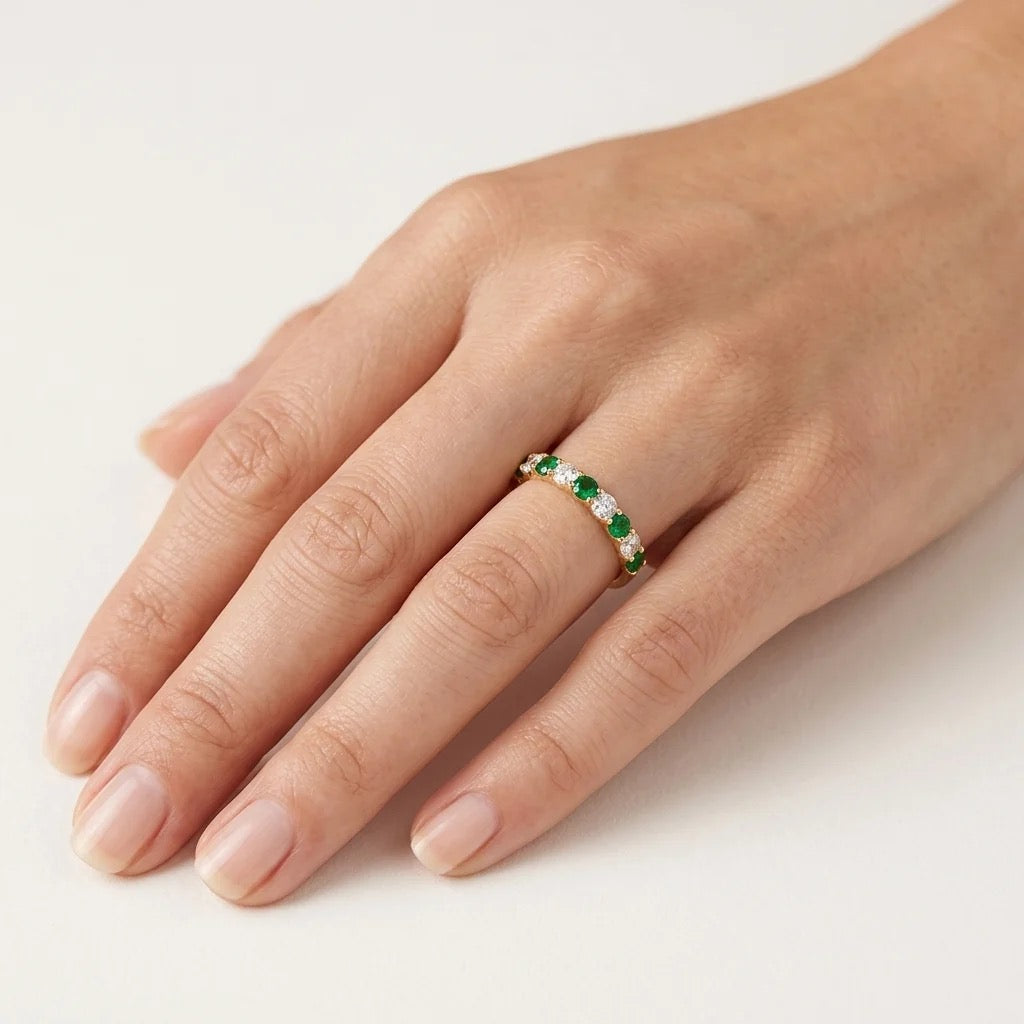 14K yellow gold natural diamond and emerald band ring shown on hand