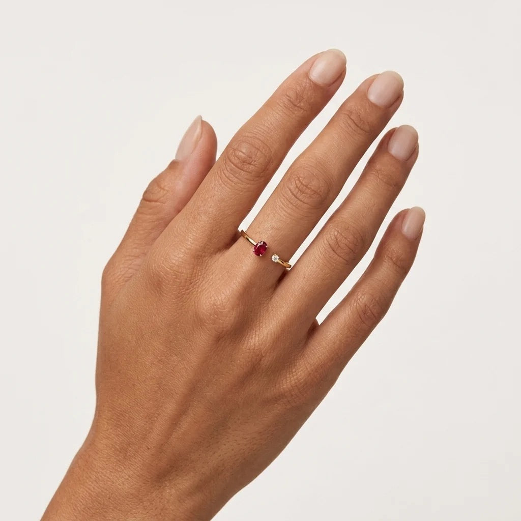 14K yellow gold natural ruby and diamond bypass ring shown on hand