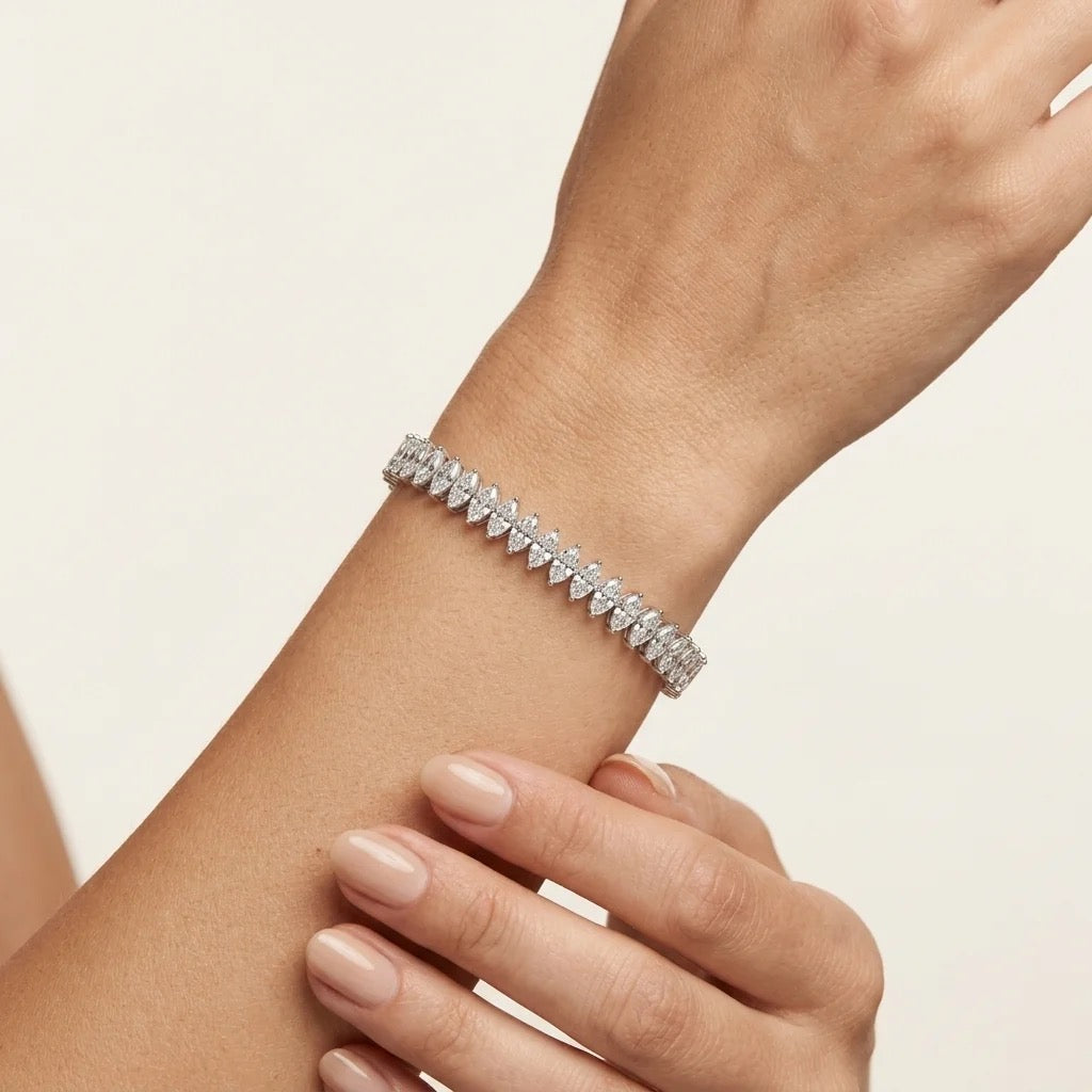Natural marquise diamond tennis bracelet worn on wrist