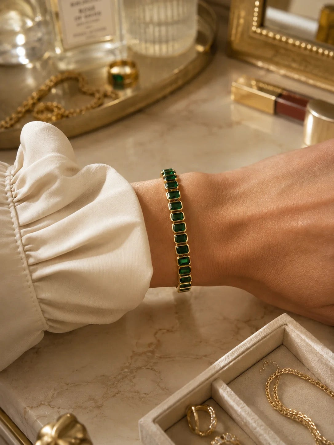 6mm green CZ baguette tennis bracelet worn on wrist
