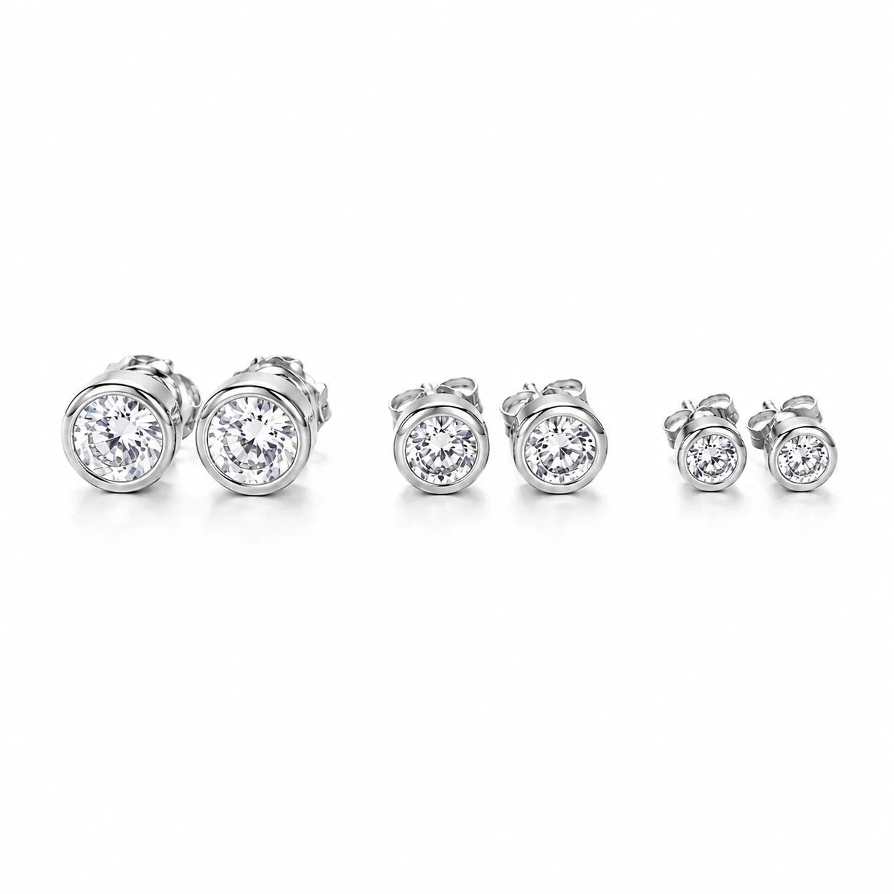 Classic bezel cubic zirconia stud earrings in rhodium finish, three sizes