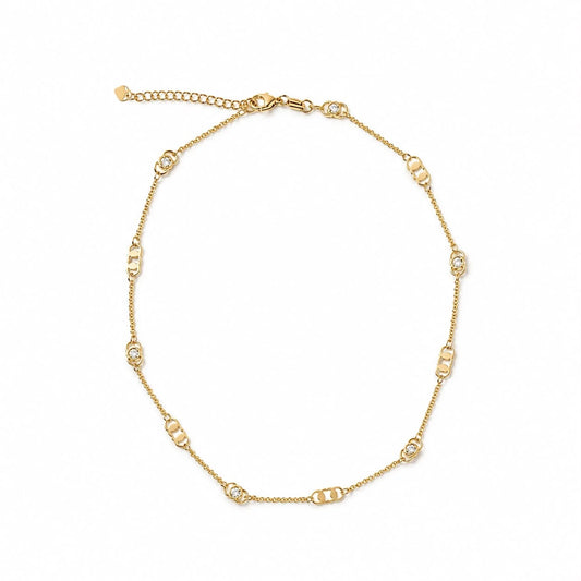 Geometric link and bezel cubic zirconia station necklace in gold finish