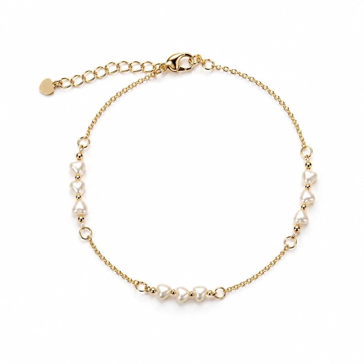 Heart-shaped pearl station bracelet in gold finish