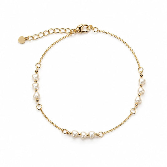 Heart-shaped pearl station bracelet in gold finish