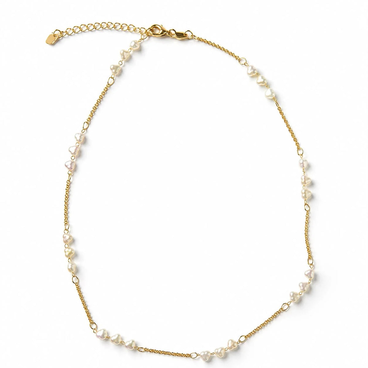 Heart-shaped pearl station necklace in gold finish