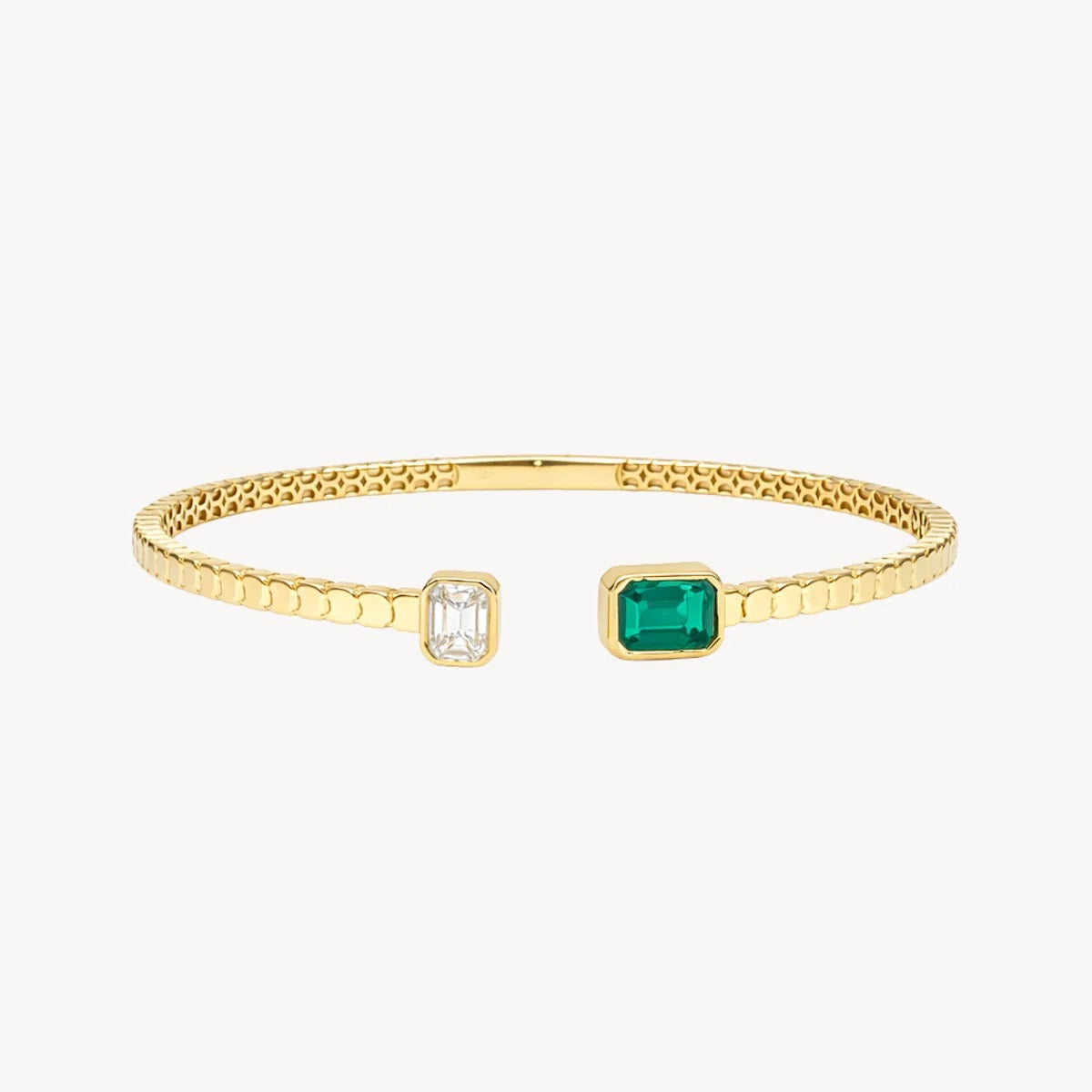 Polished solid yellow gold open cuff bracelet with emerald-cut green and clear gemstones