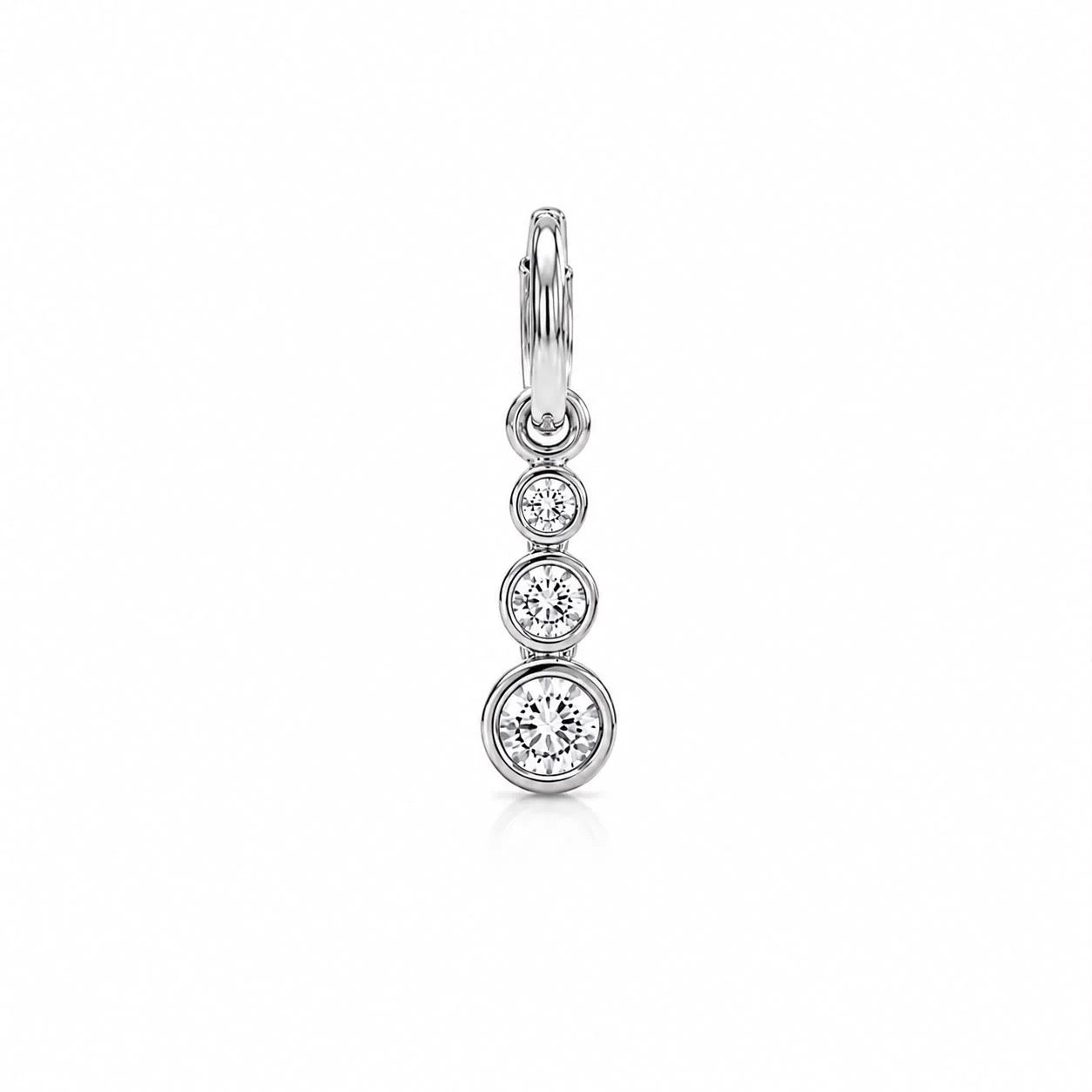 Rhodium-filled graduated three-stone CZ drop charm